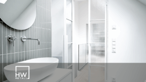 Eine Helle Lofttür im Bad neben Spiegel und Waschbecken